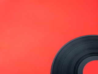 vinyl record detail, isolated on red background, with copy space
