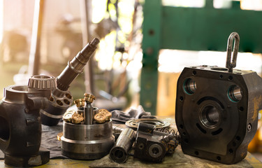 spare parts of the hydraulic piston pump on working, inspection and repair maintenance heavy...