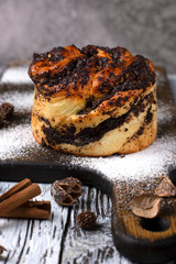 brioche with poppy seeds on a wooden board