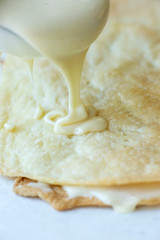 sweet cream is poured onto puff pastry