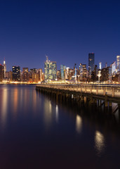 Fototapeta na wymiar View on Midtown Manhattan from East river pier during the blue hour with long exposure