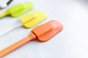 Set of multi-colored silicone spatulas, kitchen tools. Sweet pastries, recipes, cooking