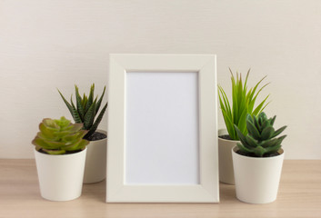 An empty photo frame on a table or shelf with a copy of the space