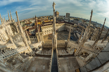 Milan, Italy - Aug 1, 2019: Aerial View from the roof of Milan Cathedral - Duomo di Milano, Lombardy, Italy. Fish eye lens shot