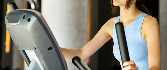 young women working out on stepper at gym