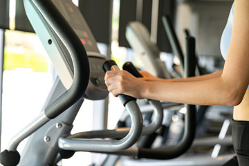 young women working out on stepper at gym