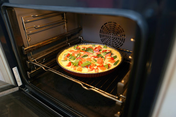 Quiche Lorraine with fish and spinach, stages of cooking