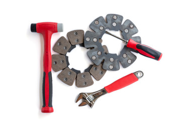 Disc brakes aircraft , screwdriver, hammer and a wrench on a white background