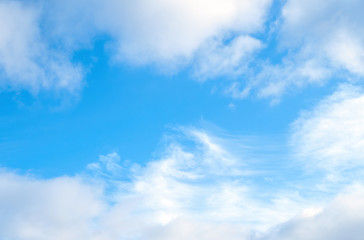 Cumulus and Cirrocumulus clouds on blue sky, nature background without focus.