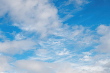 Cloudscape background, Cirrocumulus and cumulus clouds on blue sky, without focus.