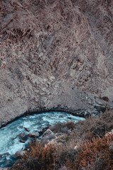 stormy mountain rocky river with clear water