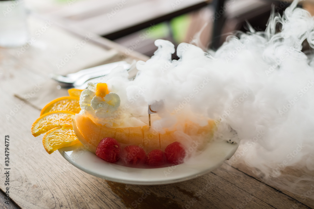 Wall mural mixed fruits and ice cream with liquid nitrogen