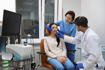 Fototapeta premium Professional doctors examining patient before surgery in clinic