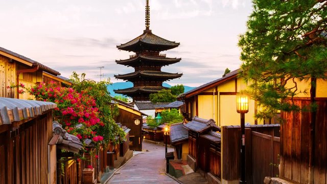 Kyoto, Japan. A sunrise timelapse with a view of To-ji temple and a row of old japanese shops and houses in Kyoto, Japan. Time-lapse, panning video