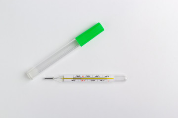 medical thermometer and case isolated on a white background