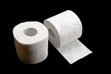 Tissue paper roll for bathroom. Soft Toilet paper isolated on black background. Bathroom hygiene concept