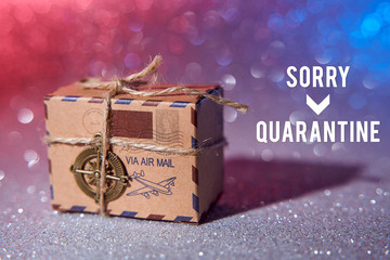 paper boxes on a glittering glitter background symbolize delayed trips abroad due to coronavirus beautiful blur bokeh background