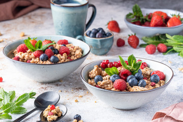 Tasty Strawberry Dessert, Homemade Yogurt with Strawberries, Granola and blueberries, raspberries and red currants. Seeds, Healthy Breakfast, Parfait in a Jar over Bright Background