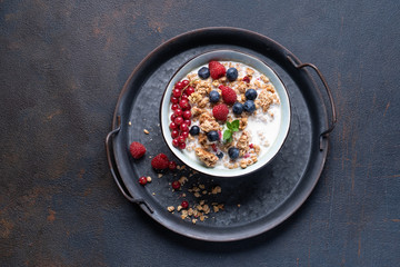 Tasty Strawberry Dessert, Homemade Yogurt with Strawberries, Granola and blueberries, raspberries and red currants. Seeds, Healthy Breakfast, Parfait in a Jar over Bright Background