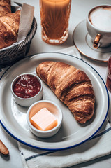 French breakfast table with croissant and coffee