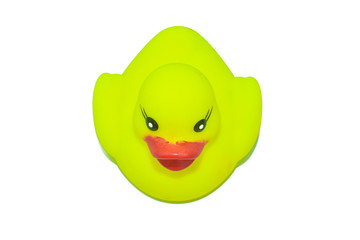 A yellow color miniature plastic toy of a duck isolated on a white background
