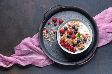 Tasty Strawberry Dessert, Homemade Yogurt with Strawberries, Granola and blueberries, raspberries and red currants. Seeds, Healthy Breakfast, Parfait in a Jar over Bright Background