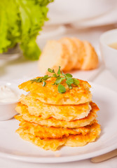 Hash browns potato pancakes draniki on the white plate. Breakfast.