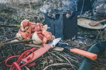 Cooking while hiking with a backpack.