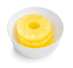 Pineapple rings ib a bowl. Fresh Pineapple slice isolated on white background. Close up. Top view