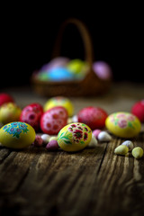 Easter composition on a wooden background. Hand painting Easter eggs. The concept of religious holidays, family traditions. Selective focus.