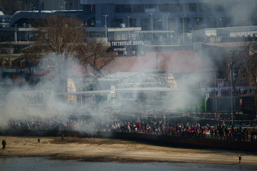People celebrate the holiday on the city's embankment.