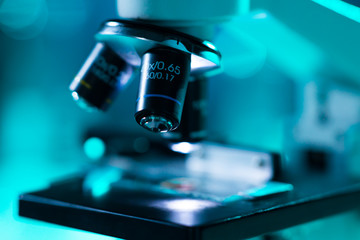 Close-up of scientific microscope. Laboratory in hospital. Epidemic disease, healthcare, vaccine research and coronavirus 2019-ncov test.