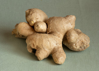 Ginger root on linen background, close-up