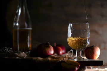 Apple cider on the wooden background