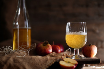 Apple cider on the wooden background