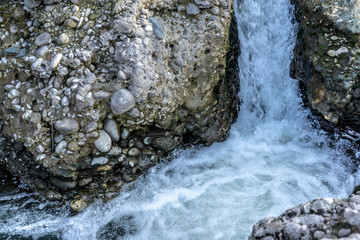 The rapid flow of a mountain river