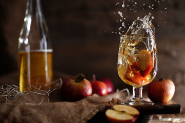 Apple cider on the wooden background