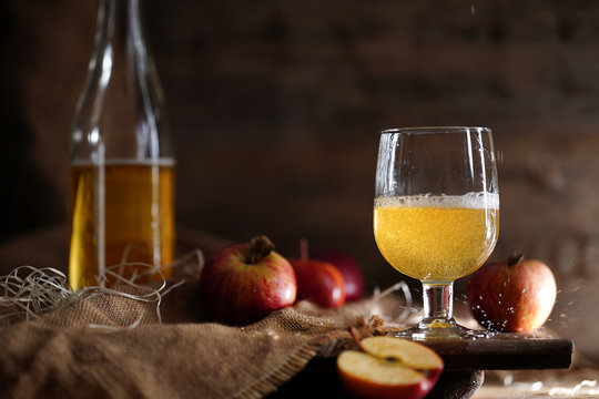 Apple cider on the wooden background