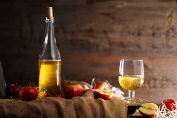 Apple cider on the wooden background