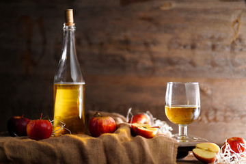 Apple cider on the wooden background