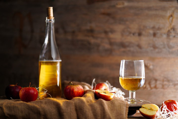 Apple cider on the wooden background