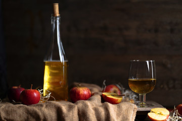 Apple cider on the wooden background