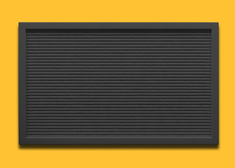 Empty black message board on the yellow background 