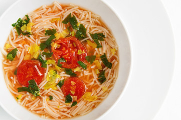 tomato soup with vermicelli and herbs