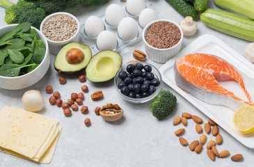 Keto diet concept. Ketogenic diet food-vegetables, fish, eggs, cheese, nuts. Balanced low-carb food background. 