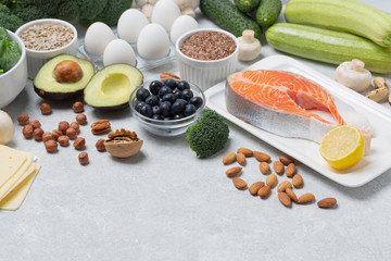 Keto diet concept. Ketogenic diet food-vegetables, fish, eggs, cheese, nuts. Balanced low-carb food background. 