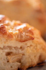 Tasty, fragrant and tender scones with apples from the oven close-up