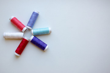 spools of thread and needle