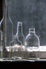 Different glass bottles on the windowsill.