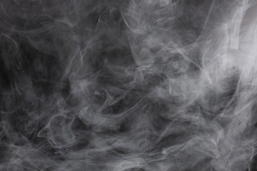 White steam on a black background.